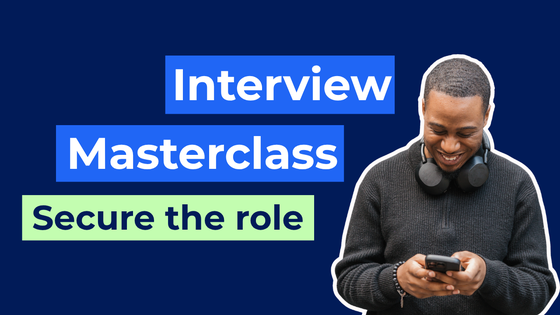 A Bright Network member smiling at his phone with the words "Interview Masterclass: Secure the role"