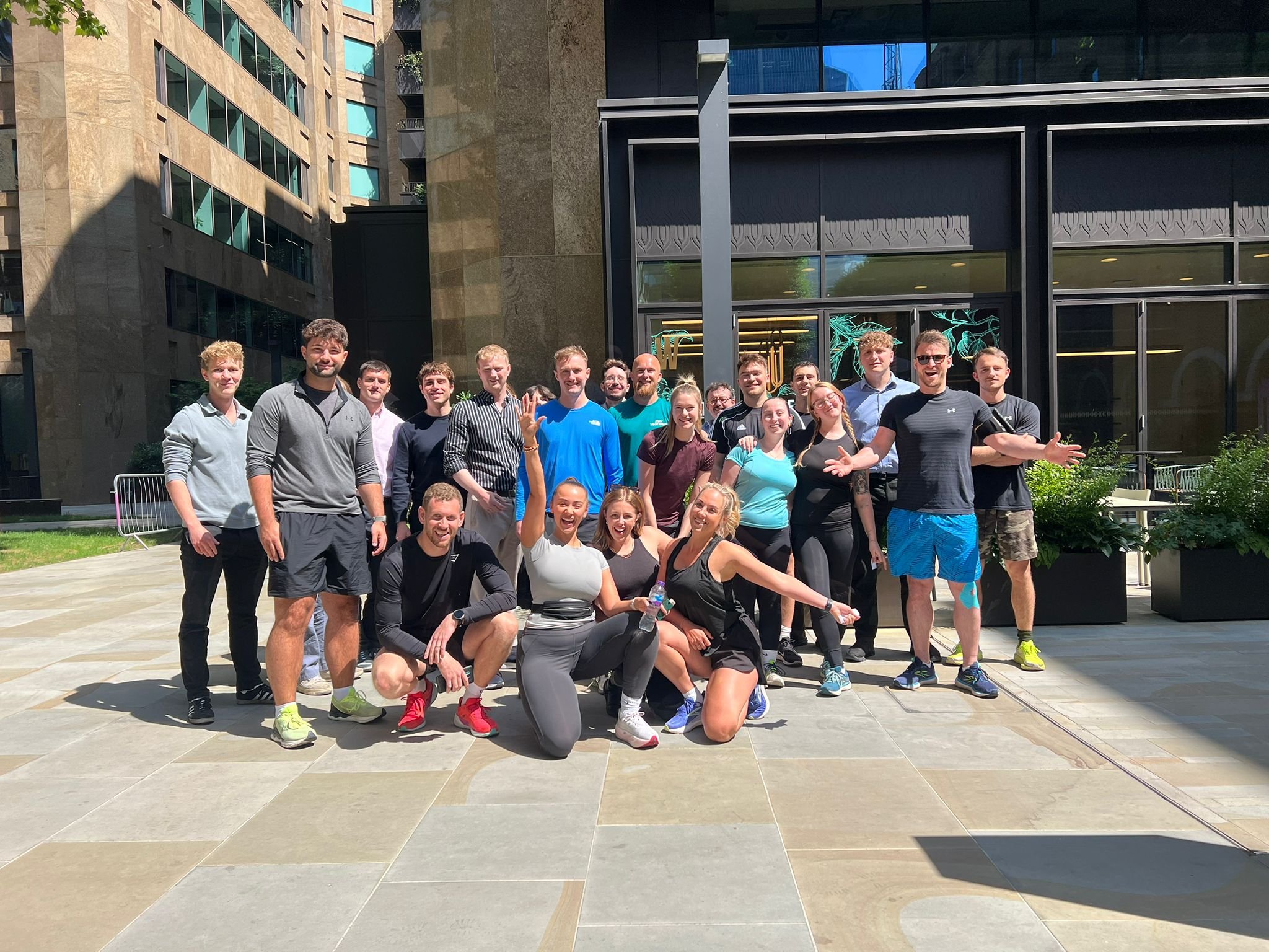 A photo of a group of people in running gear