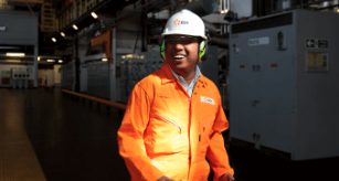 Male EDF employee working on site and wearing protective clothing
