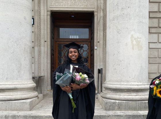 Picture of Bright Network member Zina smiling at her graduation