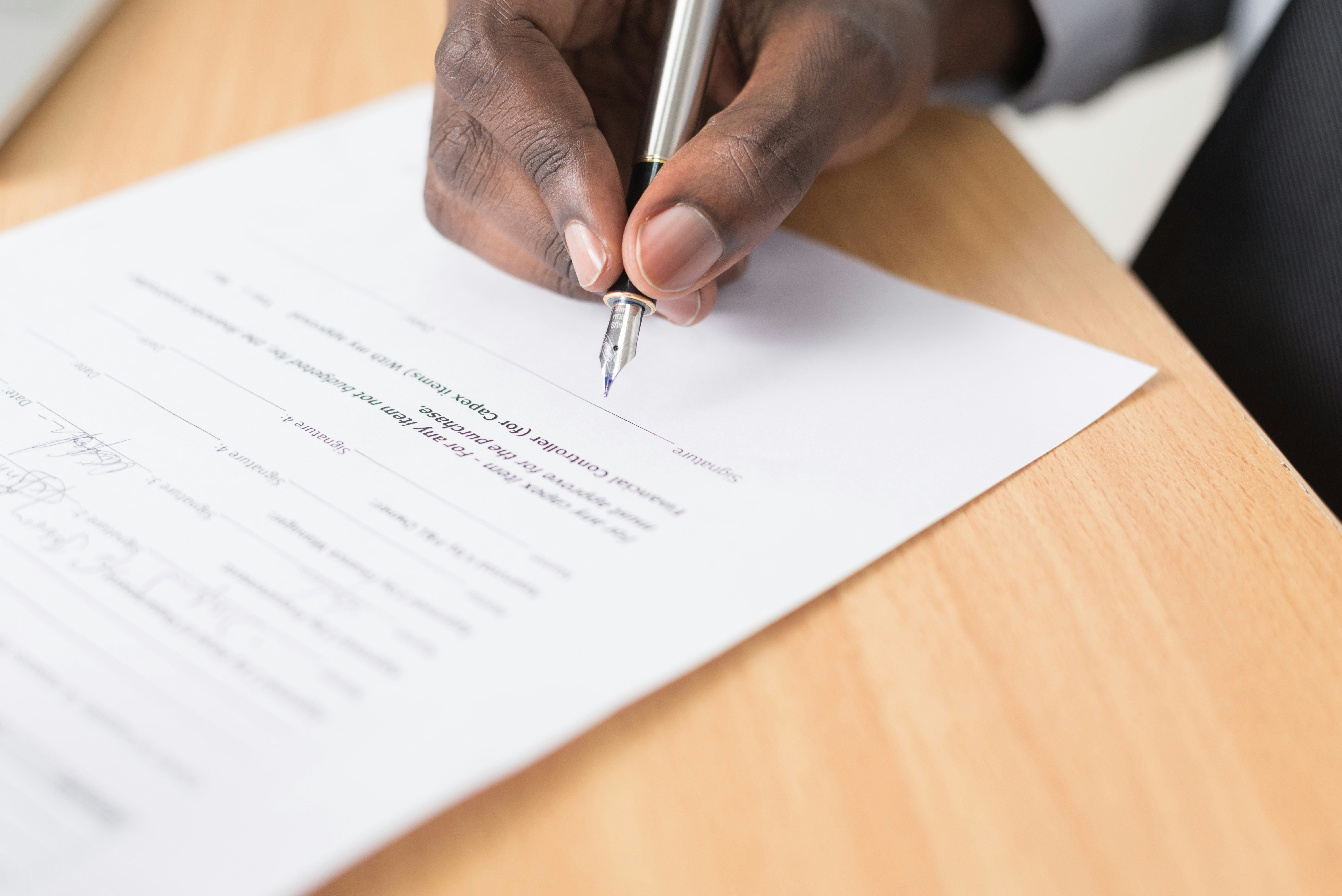 A man signing a legal document