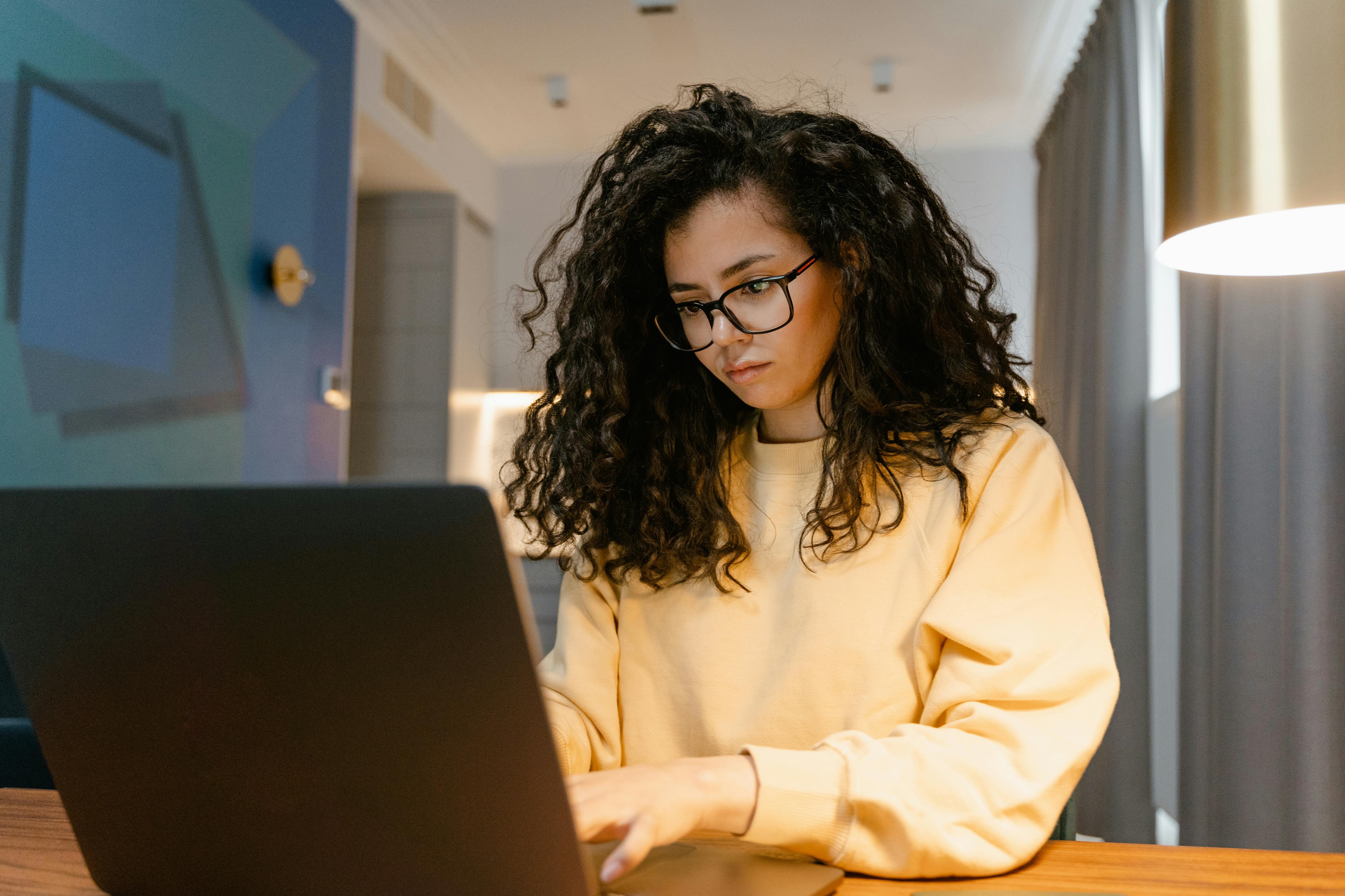 Young woman typing on her laptop.